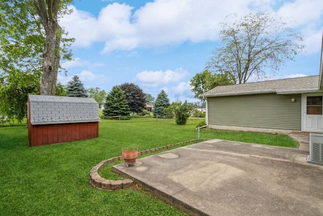 5660 Briarwood St SW, Cedar Rapids, IA 52401 - view of green lawn with a patio area and a storage unit
