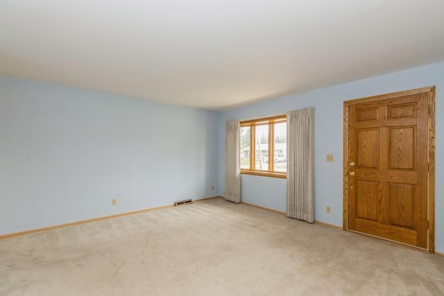 5660 Briarwood St SW, Cedar Rapids, IA 52401 - empty room featuring light colored carpet and baseboards