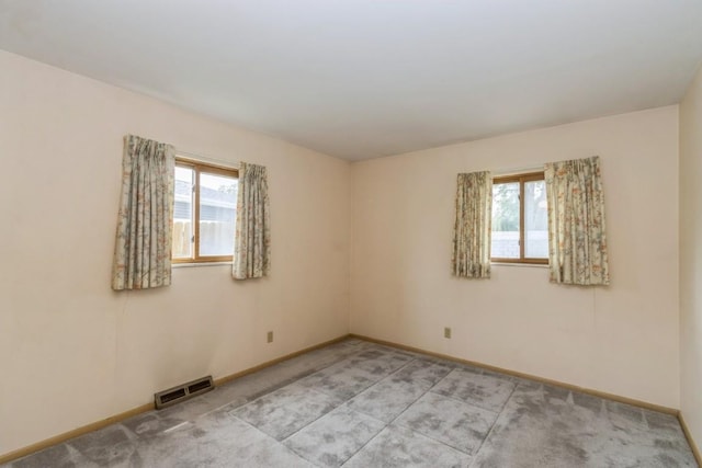 5660 Briarwood St SW, Cedar Rapids, IA 52401 - spare room with baseboards and light colored carpet