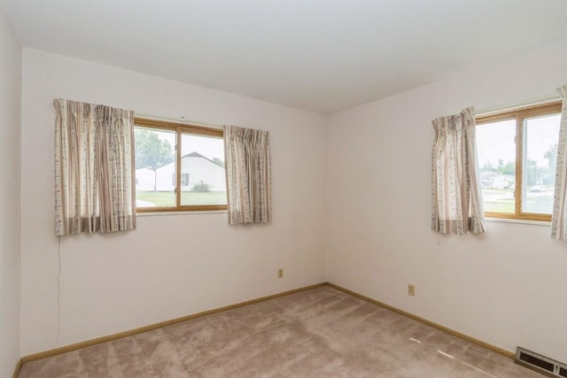 5660 Briarwood St SW, Cedar Rapids, IA 52401 - empty room with baseboards and light carpet