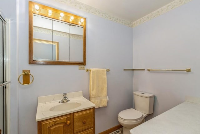 5660 Briarwood St SW, Cedar Rapids, IA 52401 - bathroom with vanity and a shower with shower door