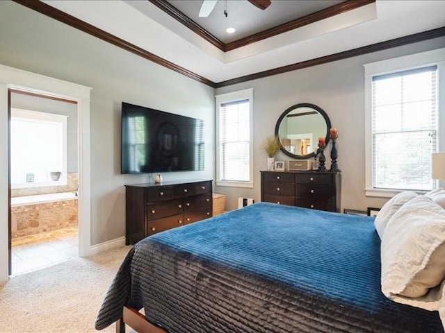 4390 Flagstick Dr, Marion, IA 52302 - carpeted bedroom featuring ornamental molding, a tray ceiling, connected bathroom, and a ceiling fan