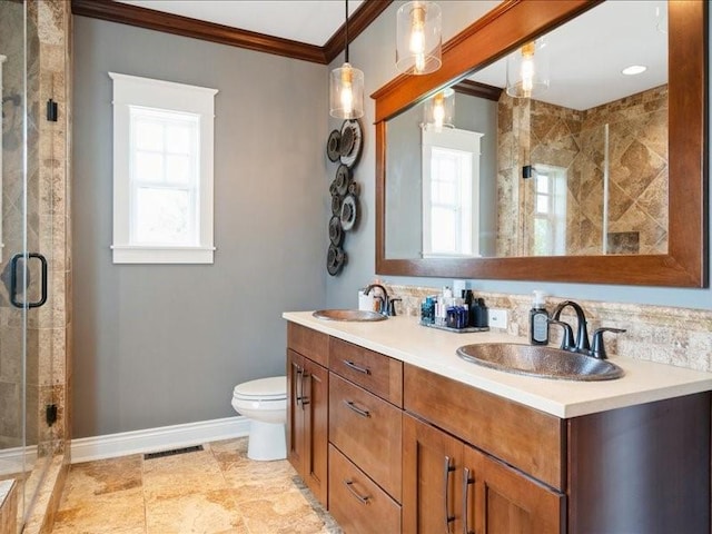 4390 Flagstick Dr, Marion, IA 52302 - bathroom with ornamental molding, plenty of natural light, double vanity, and a shower stall
