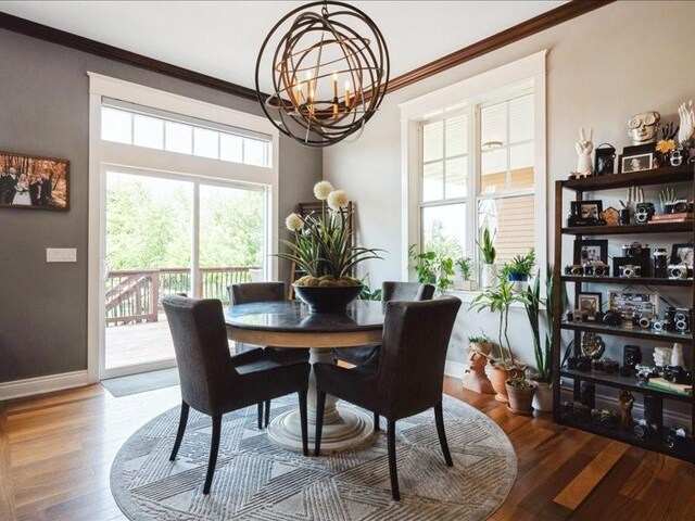 4390 Flagstick Dr, Marion, IA 52302 - dining room with a chandelier, crown molding, and wood finished floors
