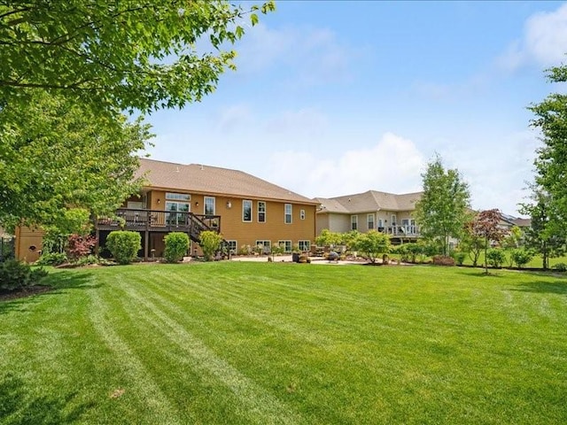 4390 Flagstick Dr, Marion, IA 52302 - view of green lawn with a deck and stairway