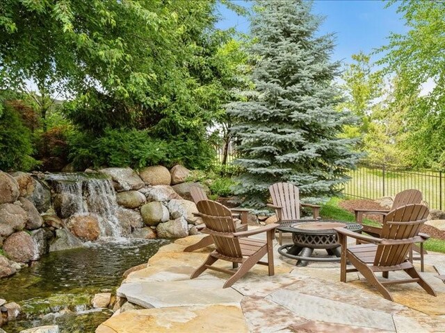 4390 Flagstick Dr, Marion, IA 52302 - view of patio / terrace with a fire pit