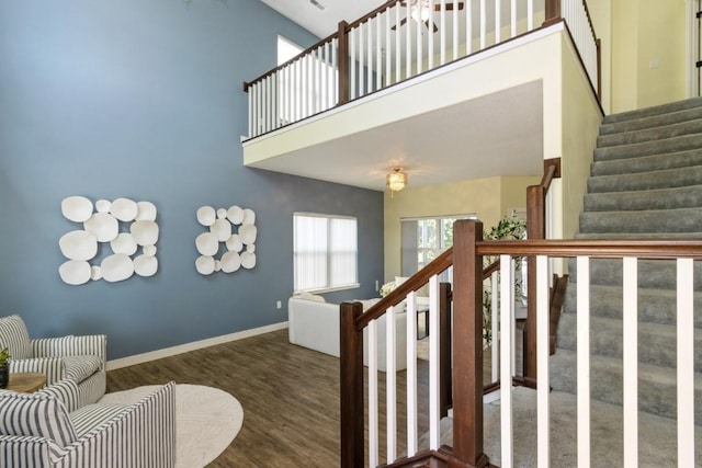 3076 Lower W Branch Rd, Iowa City, IA 52245 - stairs with a high ceiling and wood finished floors