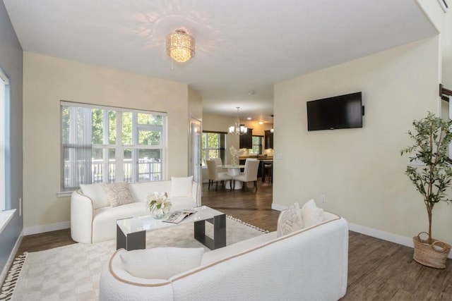 3076 Lower W Branch Rd, Iowa City, IA 52245 - living area featuring wood finished floors and a chandelier