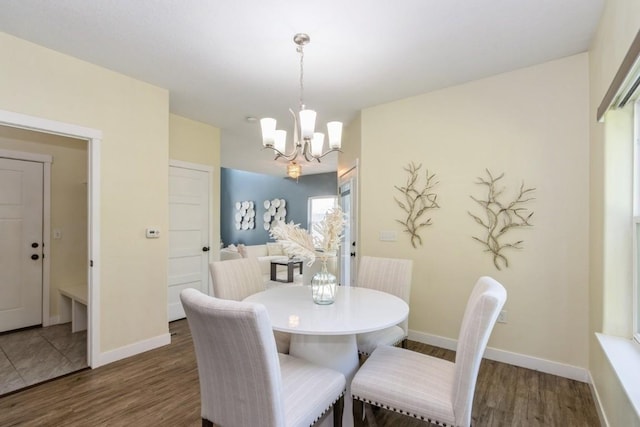 3076 Lower W Branch Rd, Iowa City, IA 52245 - dining room with a chandelier and wood finished floors
