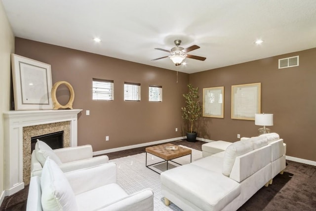 3076 Lower W Branch Rd, Iowa City, IA 52245 - living room featuring a ceiling fan, recessed lighting, a premium fireplace, and dark colored carpet