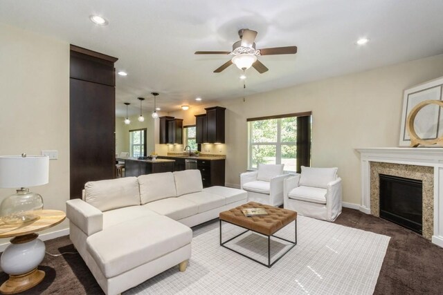 3076 Lower W Branch Rd, Iowa City, IA 52245 - carpeted living area with a ceiling fan, a fireplace, and recessed lighting