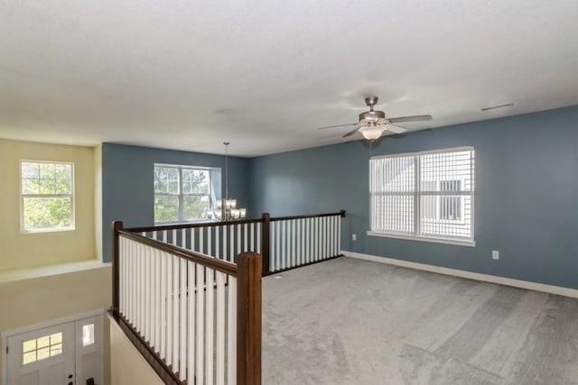 3076 Lower W Branch Rd, Iowa City, IA 52245 - spare room with a chandelier, healthy amount of natural light, carpet floors, and ceiling fan