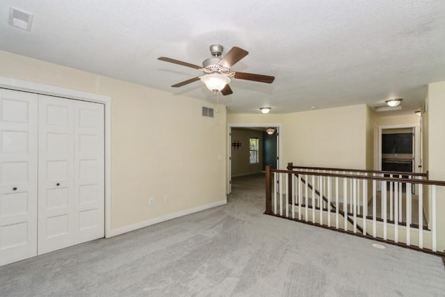 3076 Lower W Branch Rd, Iowa City, IA 52245 - carpeted spare room with a ceiling fan and baseboards