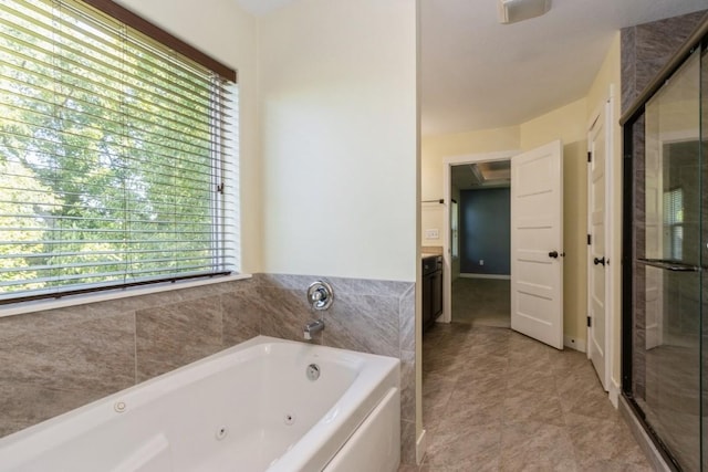 3076 Lower W Branch Rd, Iowa City, IA 52245 - bathroom featuring a tub with jets, a shower stall, tile patterned flooring, and vanity