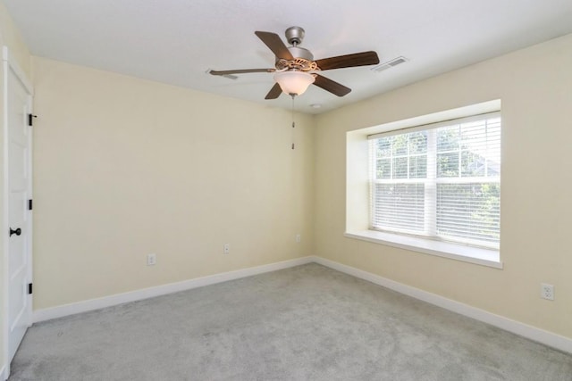 3076 Lower W Branch Rd, Iowa City, IA 52245 - empty room featuring a ceiling fan and light carpet