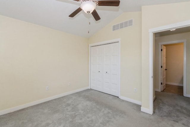 3076 Lower W Branch Rd, Iowa City, IA 52245 - unfurnished bedroom featuring carpet flooring, lofted ceiling, a closet, and ceiling fan