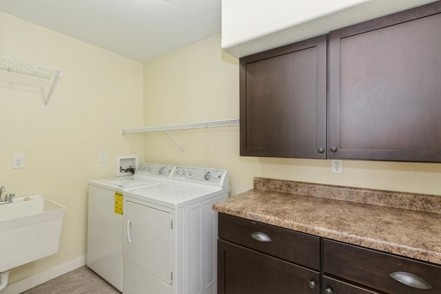 3076 Lower W Branch Rd, Iowa City, IA 52245 - washroom featuring cabinet space and washing machine and dryer