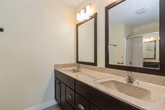 3076 Lower W Branch Rd, Iowa City, IA 52245 - full bath featuring double vanity and a shower with shower door
