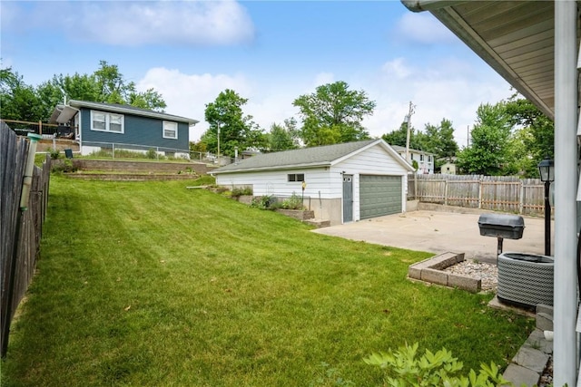 3624 Bel Air Dr SE, Cedar Rapids, IA 52403 - fenced backyard with an outdoor structure, a detached garage, and a patio
