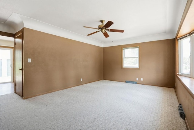 3624 Bel Air Dr SE, Cedar Rapids, IA 52403 - unfurnished room featuring carpet, plenty of natural light, and a ceiling fan
