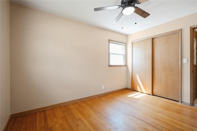 3624 Bel Air Dr SE, Cedar Rapids, IA 52403 - unfurnished bedroom with light wood finished floors, a closet, and a ceiling fan