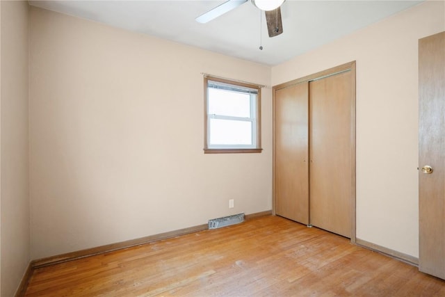 3624 Bel Air Dr SE, Cedar Rapids, IA 52403 - unfurnished bedroom with light wood-style floors, a closet, and a ceiling fan
