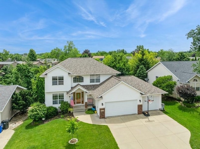 2815 Oak Crest Ct NW, Cedar Rapids, IA 52405 - traditional-style house with a garage, concrete driveway, a front lawn, and a shingled roof
