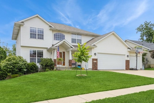 2815 Oak Crest Ct NW, Cedar Rapids, IA 52405 - view of front facade featuring concrete driveway, a front yard, an attached garage, and brick siding