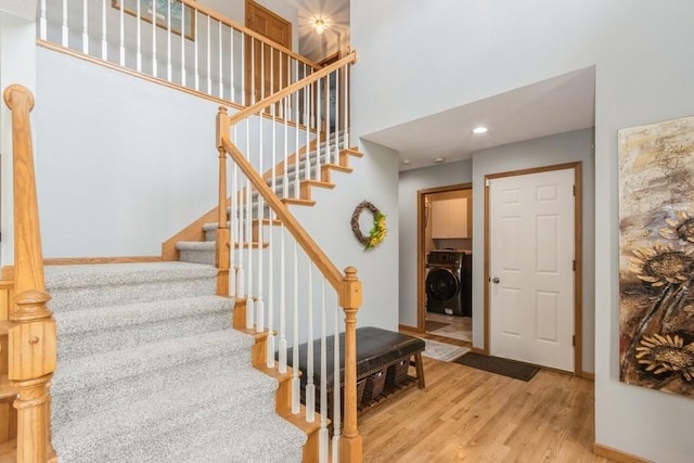 2815 Oak Crest Ct NW, Cedar Rapids, IA 52405 - staircase with wood finished floors and a high ceiling