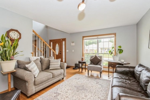 2815 Oak Crest Ct NW, Cedar Rapids, IA 52405 - living room with stairs and light wood-style flooring