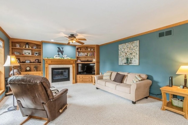 2815 Oak Crest Ct NW, Cedar Rapids, IA 52405 - carpeted living area featuring ceiling fan, a fireplace, crown molding, and built in shelves