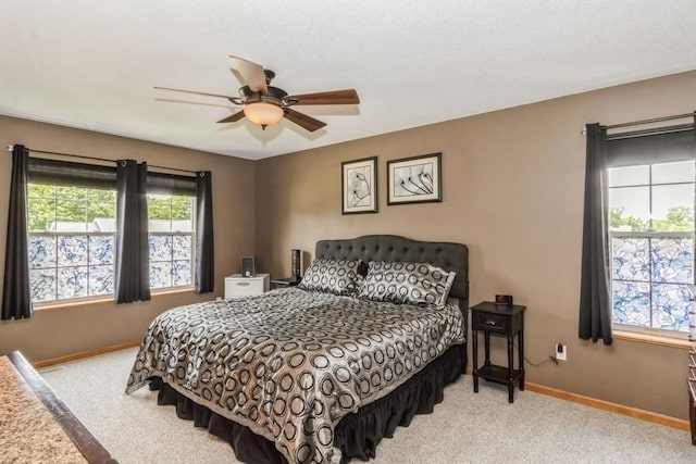 2815 Oak Crest Ct NW, Cedar Rapids, IA 52405 - carpeted bedroom featuring baseboards and ceiling fan