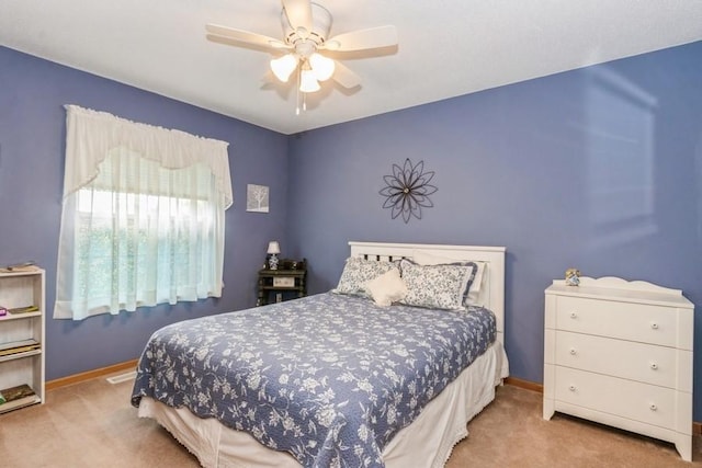 2815 Oak Crest Ct NW, Cedar Rapids, IA 52405 - bedroom featuring carpet and a ceiling fan