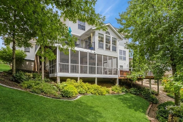2815 Oak Crest Ct NW, Cedar Rapids, IA 52405 - rear view of property with a sunroom and a lawn