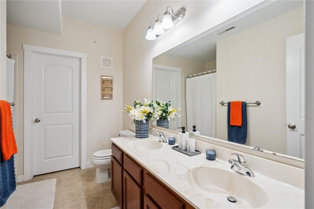 1848 W Benton St, Iowa City, IA 52246 - full bath featuring double vanity and toilet