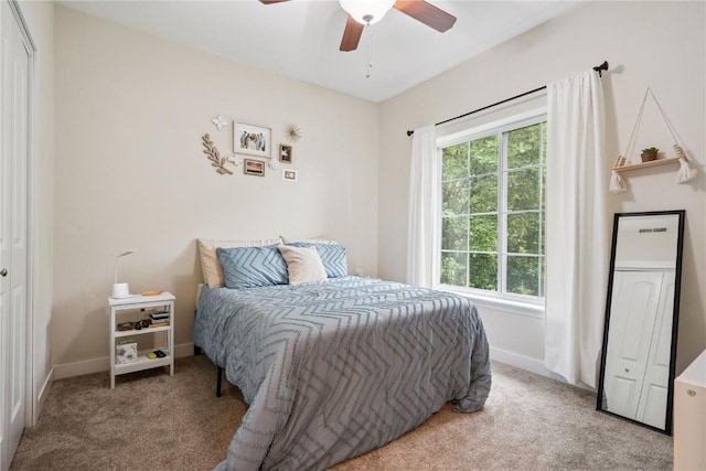 1848 W Benton St, Iowa City, IA 52246 - carpeted bedroom with baseboards and a ceiling fan