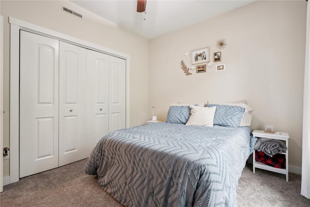 1848 W Benton St, Iowa City, IA 52246 - bedroom with carpet floors, a closet, and a ceiling fan