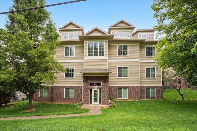 1848 W Benton St, Iowa City, IA 52246 - view of front facade with a front lawn, brick siding, and french doors