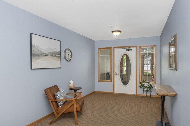 2601 Hickory Trl Unit 1, Iowa City, IA 52245 - foyer entrance with carpet floors and baseboards