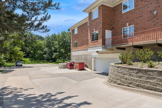 2601 Hickory Trl Unit 1, Iowa City, IA 52245 - view of side of property with brick siding and a garage