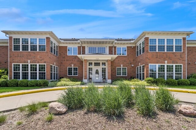 2601 Hickory Trl Unit 1, Iowa City, IA 52245 - back of property featuring french doors and brick siding