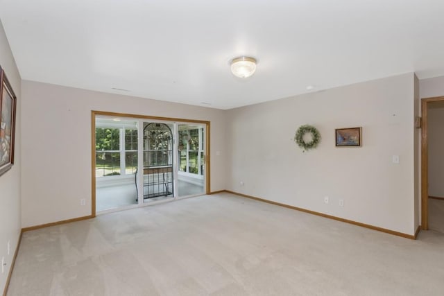 2601 Hickory Trl Unit 1, Iowa City, IA 52245 - unfurnished room featuring light colored carpet and baseboards