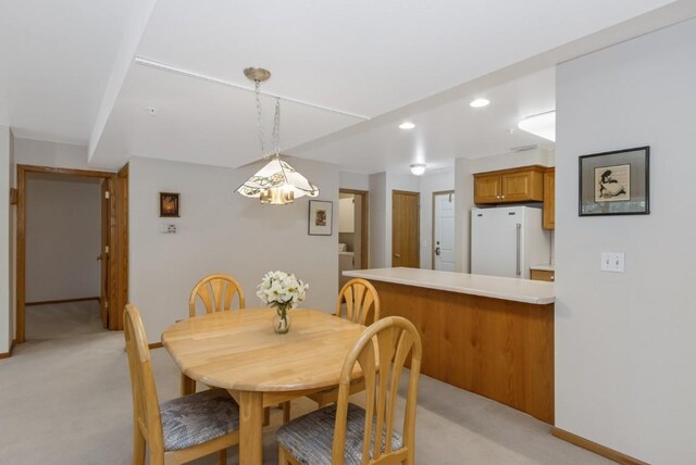2601 Hickory Trl Unit 1, Iowa City, IA 52245 - dining area with light carpet and recessed lighting