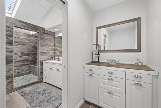 2060 Holiday Rd, Coralville, IA 52241 - full bathroom featuring vanity, walk in shower, and vaulted ceiling