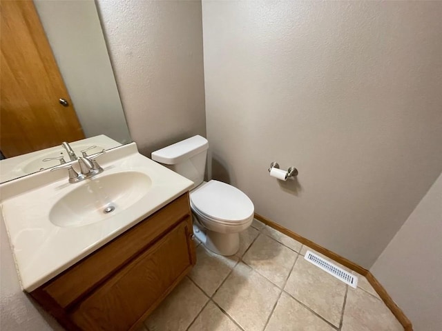 640 Magnolia Ln Unit 1, Marion, IA 52302 - half bathroom with vanity and tile patterned flooring
