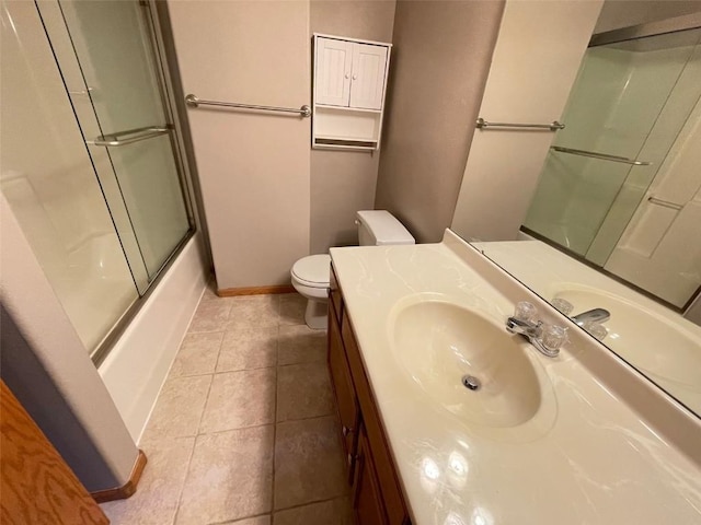 640 Magnolia Ln Unit 1, Marion, IA 52302 - bathroom featuring vanity, tile patterned flooring, and shower / bath combination with glass door