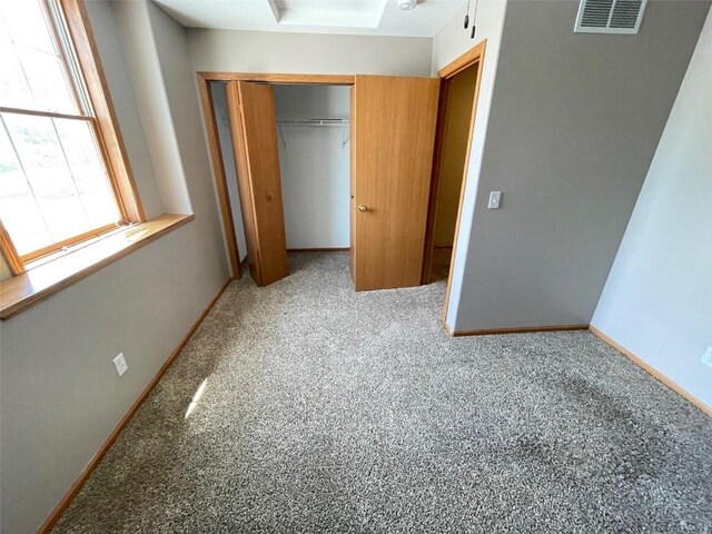 640 Magnolia Ln Unit 1, Marion, IA 52302 - unfurnished bedroom with a closet and carpet floors