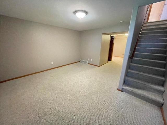640 Magnolia Ln Unit 1, Marion, IA 52302 - finished basement with light colored carpet and stairs