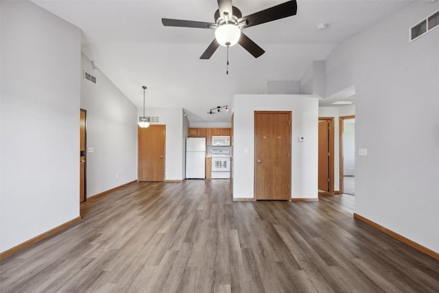 620 Colton Cir NE Unit 11, Cedar Rapids, IA 52402 - unfurnished living room with ceiling fan, wood finished floors, and high vaulted ceiling