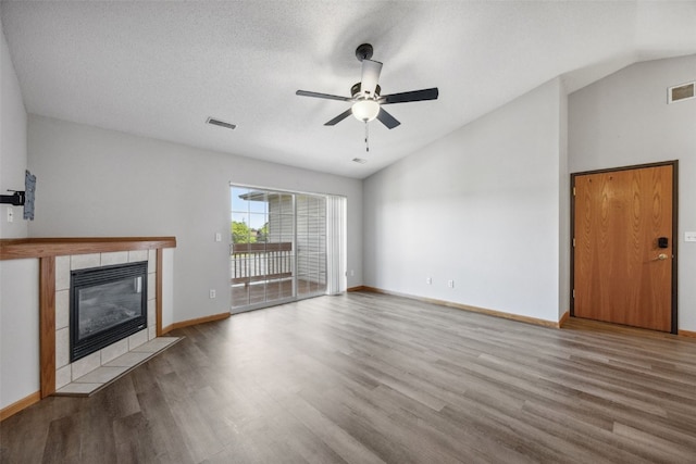 620 Colton Cir NE Unit 11, Cedar Rapids, IA 52402 - unfurnished living room featuring lofted ceiling, wood finished floors, a fireplace, and ceiling fan